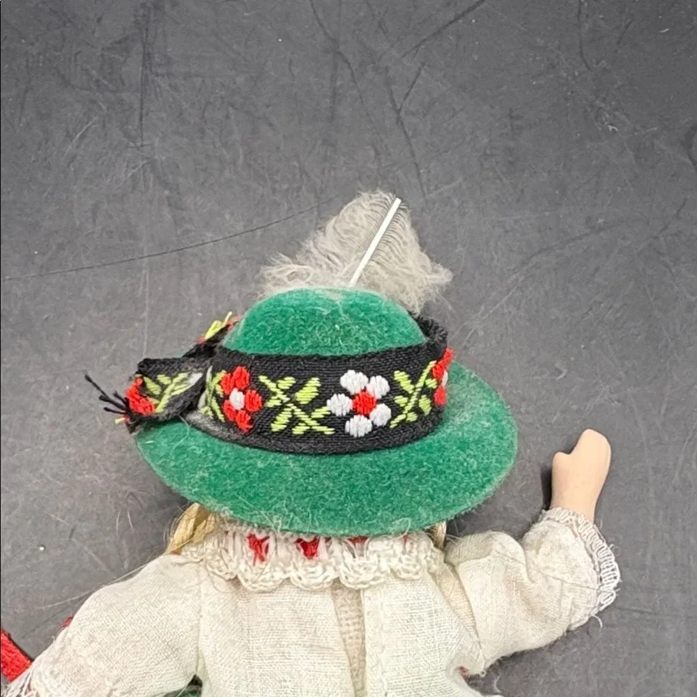 Traditional vintage porcelain doll with Green Hat and Dress